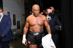 Nov 28, 2020; Los Angeles, CA, USA; Mike Tyson (black trunks) exits the ring after his split draw against Roy Jones, Jr. (white trunks) during a heavyweight exhibition