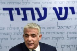 Yair Lapid, head of the centrist Yesh Atid party, delivers a statement to the press before the party faction meeting at the Knesset, Israel's parliament, in Jerusalem