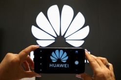 A Huawei logo is seen on a cell phone screen in their store at Vina del Mar, Chile