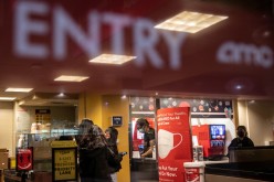 Moviegoers check in at AMC movie theater amid the coronavirus disease (COVID-19) pandemic in the Manhattan borough of New York City,