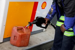 A person fills a fuel container at a Shell gas station, after a cyberattack crippled the biggest fuel pipeline in the country, run by Colonial Pipeline, in Washington, D.C., U.S.