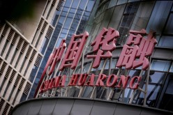 The logo of China Huarong Asset Management Co is seen at its office in Beijing, China,