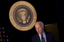 U.S. President Joe Biden departs after delivering an update on his administration's coronavirus disease (COVID-19) response in the Eisenhower Executive Office Building's South Court Auditorium 