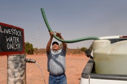 Eugene Boonie, 55, who is from Navajo Nation, fills up his water tank at the livestock water spigot in the Bodaway Chapter in the Navajo Nation, in Gap, Arizona, U.S.