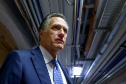 U.S. Senator Mitt Romney (R-UT) looks on as he departs after attending a bipartisan work group meeting on an infrastructure bill at the U.S. Capitol in Washington, U.S.