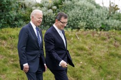 U.S. President Joe Biden arrives with Pfizer CEO, Albert Bourla, to make remarks about the coronavirus disease (COVID-19) vaccine during a visit to St. Ives in Cornwall, Britain, 