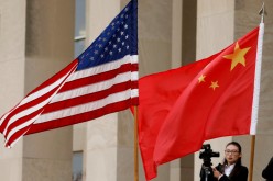 U.S. and Chinese flags are seen before a meeting between senior defence officials from both countries at the Pentagon in Arlington, Virginia,