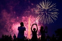 People watch the fireworks at the Washington Monument during Independence Day celebrations in Washington, U.S