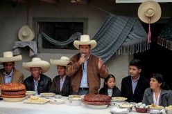 Peru's presidential candidate Pedro Castillo addresses the media during a breakfast with members of his family before casting his vote, in Chugur, Peru