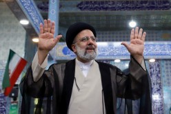 Presidential candidate Ebrahim Raisi gestures after casting his vote during presidential elections at a polling station in Tehran, Iran 