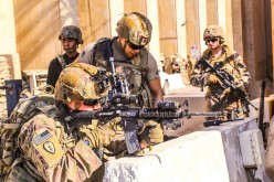 U.S. Army soldiers from 1st Brigade, 25th Infantry Division, Task Force-Iraq, man a defensive position at Forward Operating Base Union III in Baghdad, Iraq,