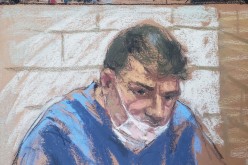 Eduard Florea appears during a virtual hearing on weapons charges in a New York