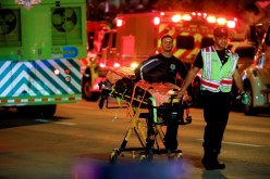 Emergency personnel work at the scene of a partial building collapse in Surfside near Miami Beach, Florida, U.S.,