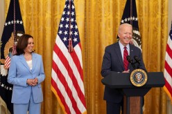 U.S. Vice President Kamala Harris stands next to U.S. President Joe Biden as he delivers remarks on the bipartisan infrastructure deal in the East Room of the White House in Washington, U.S