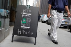 A sign advertising job openings is seen outside of a Starbucks in Manhattan, New York City, New York, U.S.,