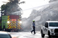 Emergency crews continue search and rescue operations for survivors of a partially collapsed residential building in Surfside,