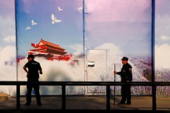 Security guards stand at the gates of what is officially known as a vocational skills education centre in Huocheng County in Xinjiang Uighur Autonomous Region,