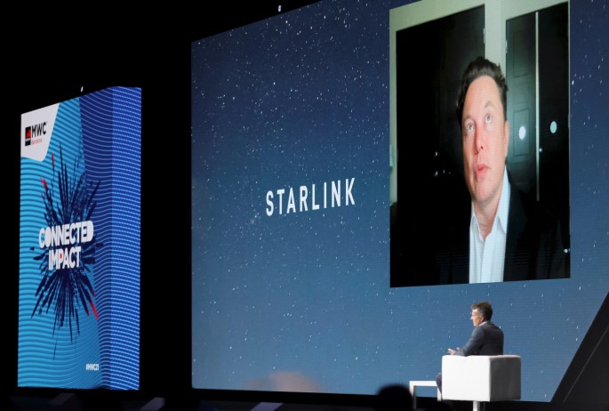 SpaceX founder and Tesla CEO Elon Musk speaks on a screen during the Mobile World Congress (MWC) in Barcelona, Spain,