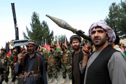 Armed men attend a gathering to announce their support for Afghan security forces and that they are ready to fight against the Taliban, 