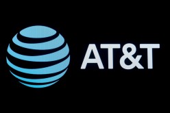 The company logo for AT&T is displayed on a screen on the floor at the New York Stock Exchange (NYSE) in New York, U.S.