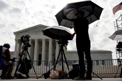 Television news photographers prepare to cover the final opinions of the current court’s term at the U.S. Supreme Court building in Washington, U.S.