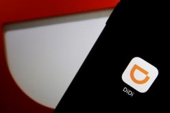 The app logo of Chinese ride-hailing giant Didi is seen on a mobile phone in this illustration picture taken 