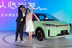 Didi Chuxing's CEO Will Cheng and President Jean Liu attend a launch event for D1 electric van by Didi and electric vehicle maker BYD, in Beijing, China