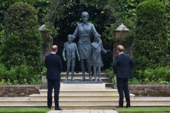 Britain's Prince William, The Duke of Cambridge, and Prince Harry, Duke of Sussex, look at a statue they commissioned of their mother Diana,