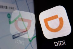 The app logo of Chinese ride-hailing giant Didi is seen reflected on its navigation map displayed on a mobile phone in this illustration picture taken