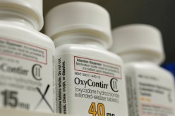 Bottles of prescription painkiller OxyContin, 40mg pills, made by Purdue Pharma L.D. sit on a shelf at a local pharmacy, in Provo, Utah, U.S