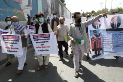Former Afghan interpreters, who worked with U.S. troops in Afghanistan, demonstrate in front of the U.S. 