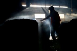 A firefighter inspects the inside of a Hashem Foods Ltd factory where a fire broke out, in Rupganj, Narayanganj district, on the outskirts of Dhaka, Bangladesh