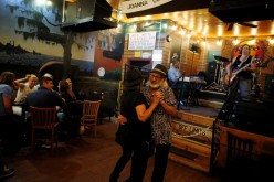 Pamela and Tom Pickens of Madison, Indiana, enjoy live music as coronavirus disease (COVID-19) restrictions are eased at blues bar Kingston Mines in Chicago, Illinois