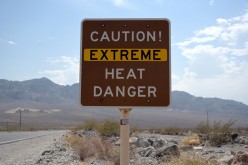A sign warns of extreme heat in Death Valley, California, U.S.,