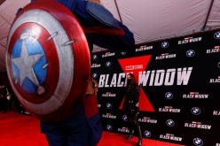 People dressed as Avengers characters attend a fan event and special screening of the film 