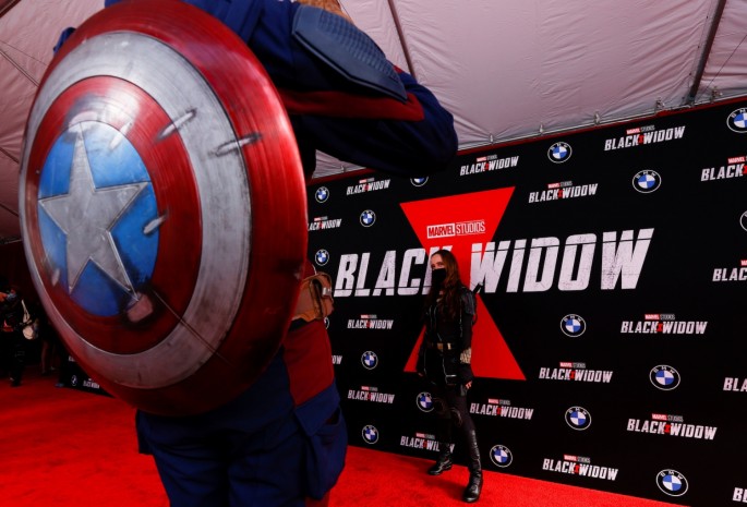 People dressed as Avengers characters attend a fan event and special screening of the film "Black Widow" at El Capitan theatre in Los Angeles, California, U.S.