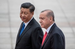 Turkish President Recep Tayyip Erdogan and China's President Xi Jinping attend a welcome ceremony at the Great Hall of the People in Beijing, China