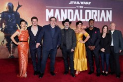 Creator Jon Favreau (3rd L), President of Lucasfilm Kathleen Kennedy (2nd R), executive producer Dave Filoni (C) pose with cast members (L-R) Ming-Na Wen, 