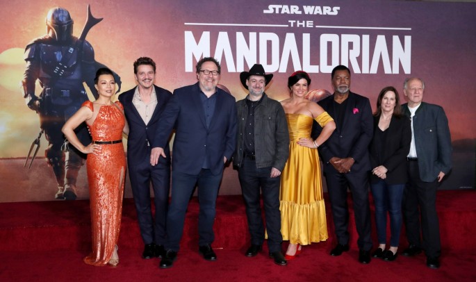 Creator Jon Favreau (3rd L), President of Lucasfilm Kathleen Kennedy (2nd R), executive producer Dave Filoni (C) pose with cast members (L-R) Ming-Na Wen, 