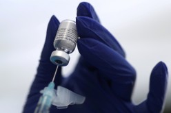A healthcare worker prepares a Pfizer coronavirus disease (COVID-19) vaccination in Los Angeles, California, U.S.