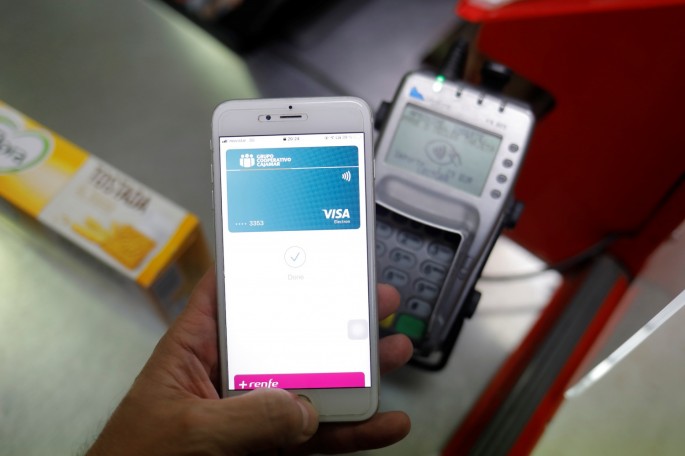 A shopper uses the mobile payment service Apple Pay at a supermarket, amid the coronavirus disease (COVID-19) outbreak, in Ronda, 