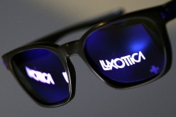 The Luxottica name is reflected in a pair of sunglasses in this photo illustration taken in Rome 