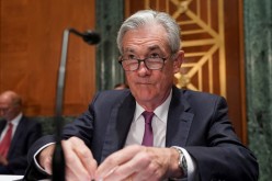 Federal Reserve Chairman Jerome Powell takes his seat to testify before a Senate Banking, Housing and Urban Affairs Committee hearing 