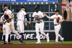 Houston Astros left fielder Yordan Alvarez (44) celebrates with shortstop Carlos Correa (1) after the Astros defeated the Oakland Athletics at Minute Maid Park