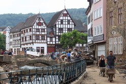 People work in an area affected by floods caused by heavy rainfalls in Bad Muenstereifel, Germany,
