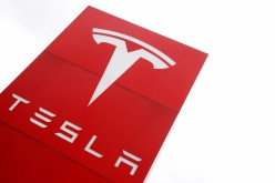 The logo of car manufacturer Tesla is seen at a dealership in London, Britain,