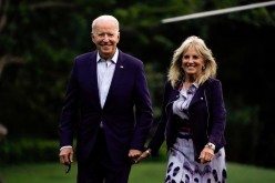 U.S. President Joe Biden and first lady Jill Biden walk from Marine One as they return from Camp David, on the South Lawn at the White House in Washington, U.S.,