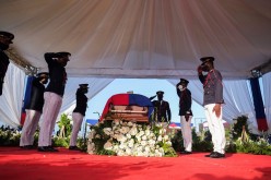 Pallbearers in military attire salute next to a coffin holding the body of late Haitian President Jovenel Moise after he was shot dead at his home in Port-au-Prince earlier this month,