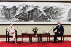 U.S. Deputy Secretary of State Wendy Sherman meets Chinese State Councilor and Foreign Minister Wang Yi in Tianjin, China in this handout picture released 