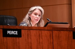 Commissioner Allison Lee participates in a U.S Securities and Exchange Commission open meeting to propose changing its decades-old definition of an 